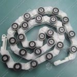 Отклоняющая цепь торца балюстрады, KONE R20, 24 звена, новый тип, белые звенья